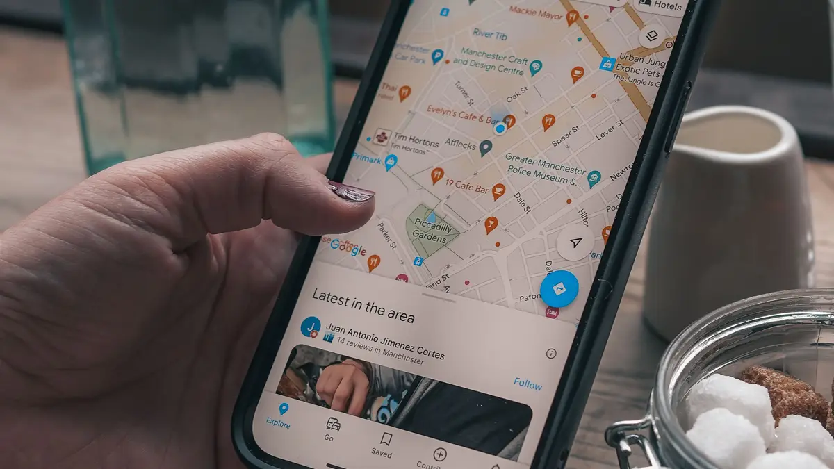 Customer searching local businesses on a smartphone map before deciding who to call