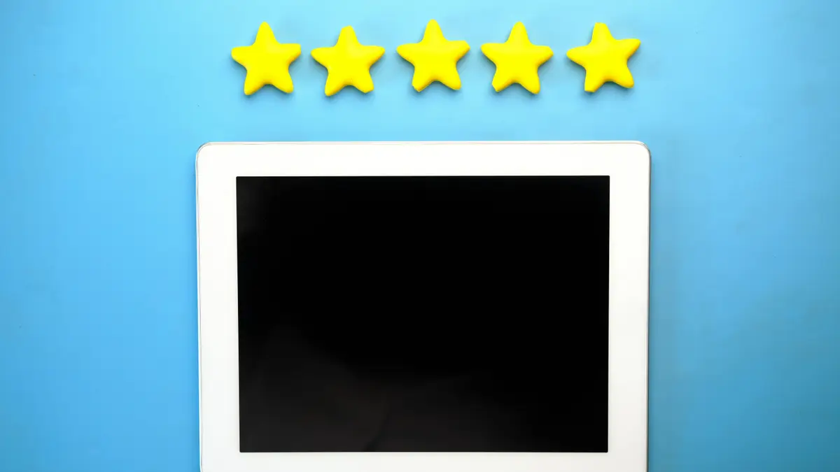 Five-star rating on a tablet representing Google reviews that build trust and drive calls